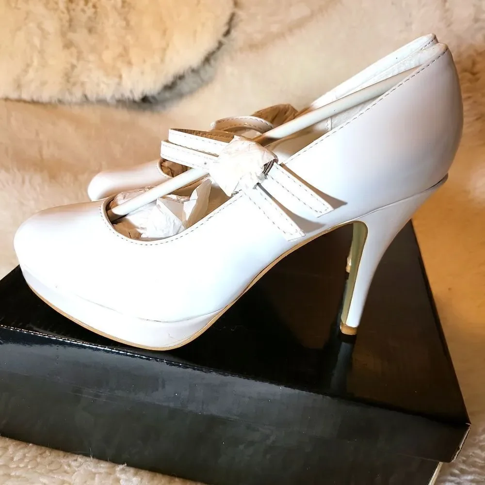 White patten Mary Jane's, with light pink platforms size 5/6